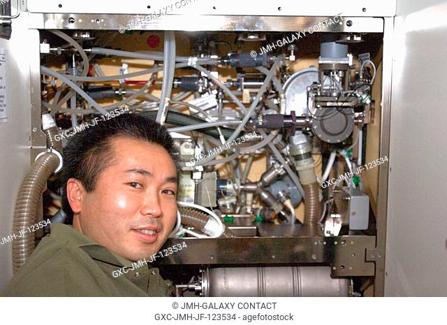 Japan Aerospace Exploration Agency (JAXA) astronaut Koichi Wakata, Expedition 1920 flight engineer, performs in-flight maintenance on the waste and hygiene...