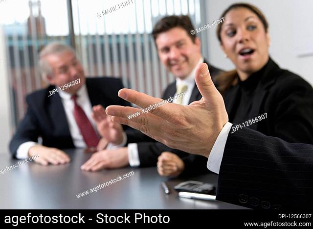 Businesspeople discussing in a boardroom