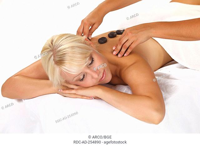 Woman getting hot stone massage hot stones basalt la stone therapy LaStone therapy