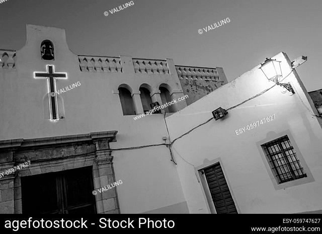 View of the small hermitage of Santa Cruz at dusk, in the Mediterranean city of Alicante, Spain; black and white image