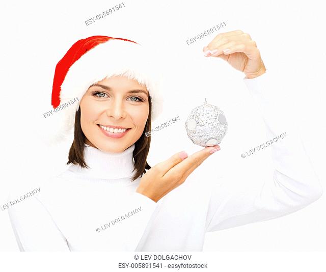 winter, people, happiness concept - woman in santa helper hat with christmas tree decoration