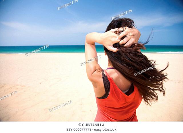 woman at beach of palmar in cadiz spain