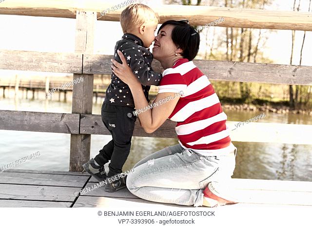 happy woman with toddler child, son, at Herrenchiemsee, Chiemsee, Bavaria, Germany
