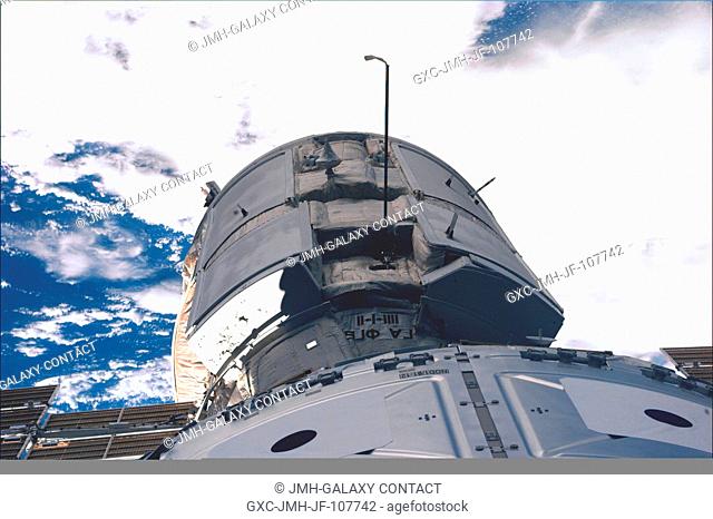 Just a few feet away from the camera lens onboard Endeavour, the Russian-built Zarya control module and the U.S.-built Unity connecting module are mated in the...