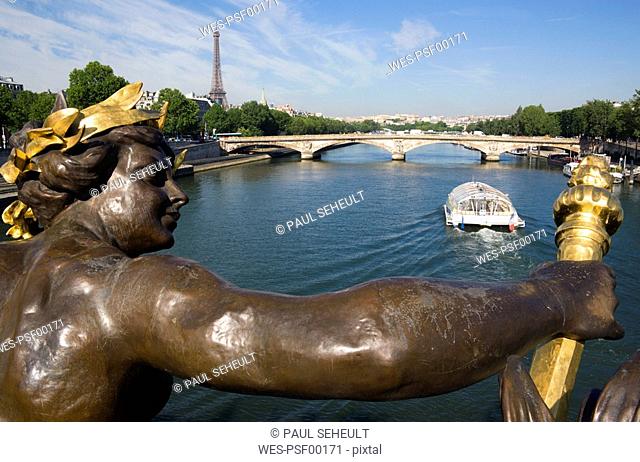 France, Paris, Seine, Pont Alexandre III, sculpture in foreground