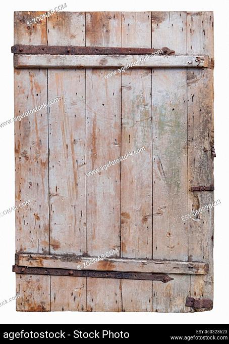 Old rotten curved wooden door of village barn. Isolated on white