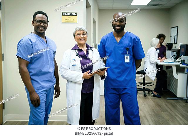 Portrait of smiling doctor and nurses