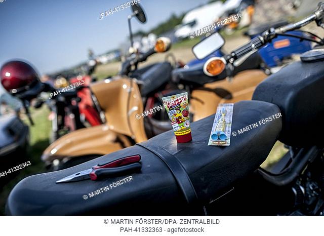 People attend the Simson meeting in Zwickau, Germany, 27 July 2013. Around 1, 500 East German cult motorcycles are expected at the meeting