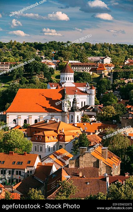 Vilnius, Lithuania. View Of Cathedral Of Theotokos And Church Of St. Johns, St. John Baptist And St. John Apostle And Evangelist In Summer Day