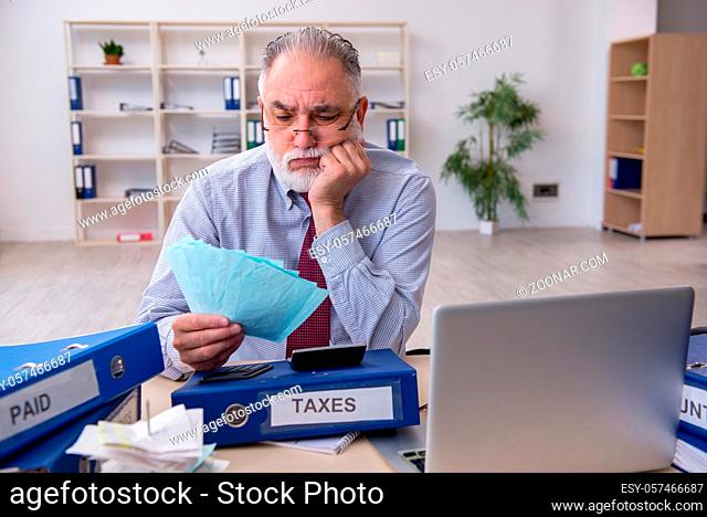 Senior accountant in budget planning concept in the office