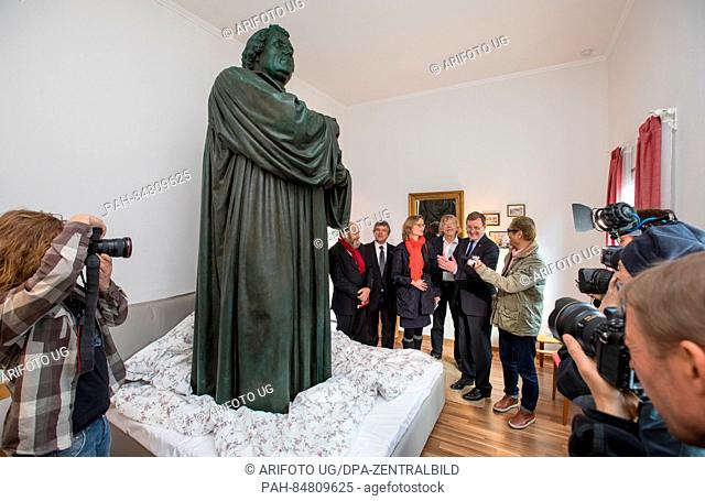 Japanese artist Tatzu Nishi (r) and state governor Bodo Ramelow (2.f.r, Linke) stand next to the Luther sculpture from Karlsplatz square that has been converted...