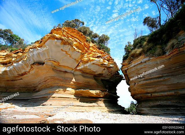 Beautiful textures and patterned sandstone, weathered and worn down by the ocean, weather and elements over time, eventually creating a cracked chasm and...