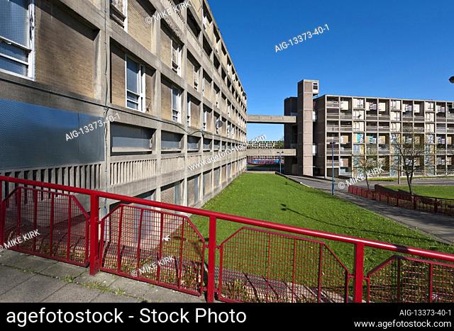 Park Hill Estate, Sheffield, lookng along a boarded-up walkway and over gardens, with the block being redeveloped by Urban Splash in the background