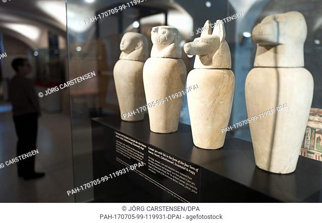 Looking at canopic jars in the figure of the four horus sons at the exhibition 'China und Ägypten. Wiegen der Welt' (lit China and Egypt
