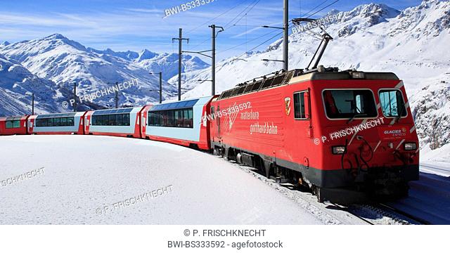 the Glacier Express in snow-covered mountain panorama, Switzerland, Andermatt