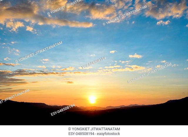 Silhouette beautiful nature landscape of the colorful sky and mountains during the sunrise for background