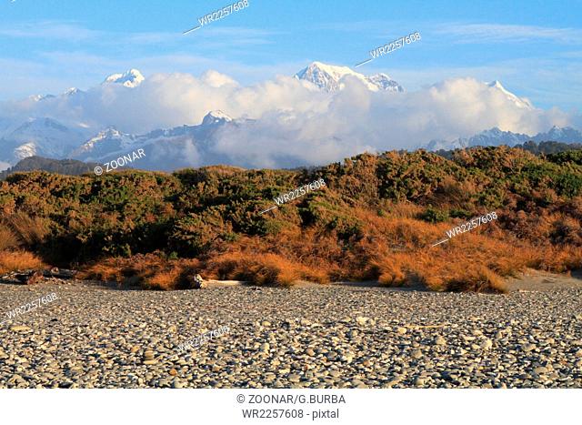 Mount Cook and Mount Tasman are seen from Gillespies Beach in Westland National Park