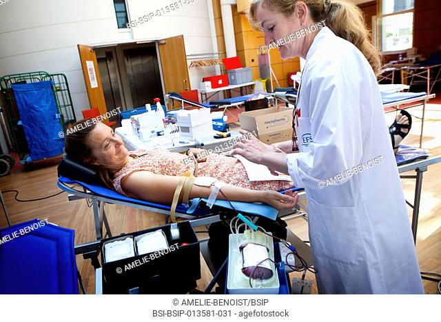 Reportage in a mobile blood donation unit run by EFS (the French Blood Establishment) in Puteaux, France. A team of nurses collect blood