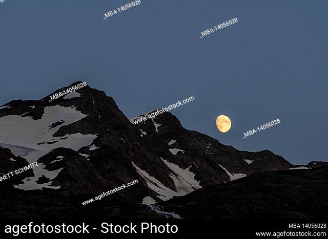 moon rise behind the venetian peaks in south tyrol
