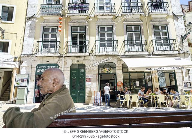 Portugal, Lisbon, historic center, centre, Mouraria, Moorish ghetto, medieval quarter, plaza, Pastelaria Capelos, Hispanic, man, senior, sitting, throat cancer