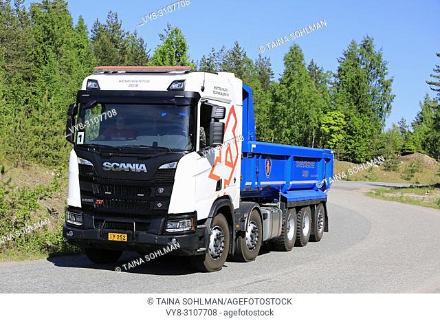 White Next Generation Scania R520 10X4 XT tipper truck on test drive on sunny day of spring during Scania Tour 2018 in Lohja, Finland - May 25, 2018