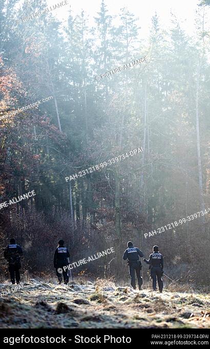 18 December 2023, Baden-Württemberg, Bingen-Hitzkofen: Police units are searching a wooded area for a two-year-old child who has been missing since Sunday...