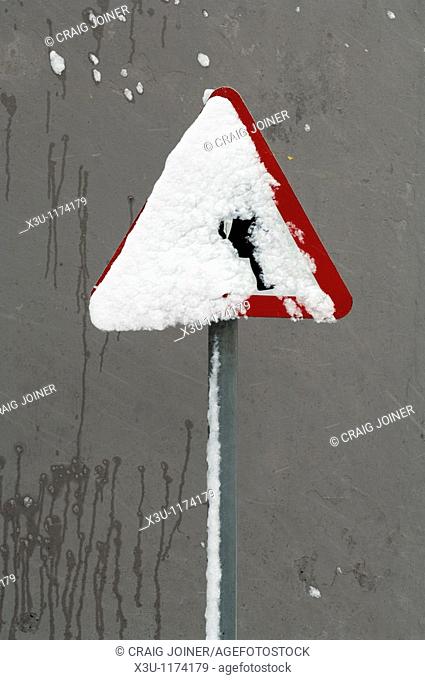 A school crossing sign covered in snow  Wrington, Somerset, England, United Kingdom