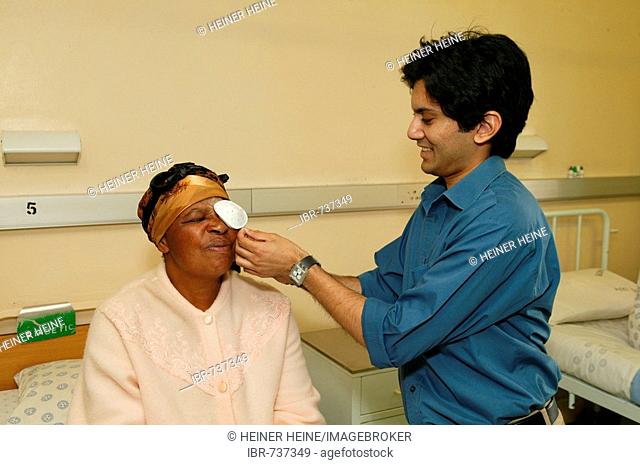 Physician and patient during follow-up examination after cataract surgery, Pietermaritzburg, South Africa, Africa