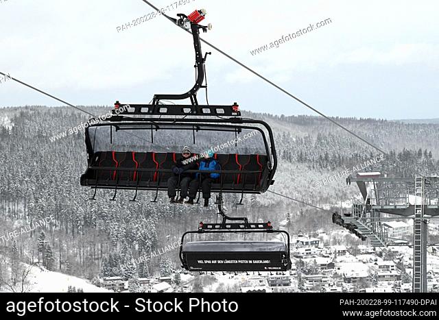 27 February 2020, Hessen, Willingen: A couple takes the ""K1"" chairlift up to the Ettelsberg. It was put into operation just over a year ago as Germany's most...