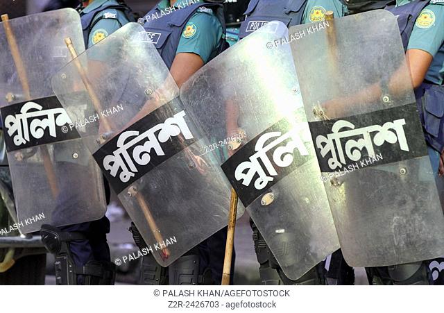 Bangladeshi police person stand guard in front of Bangladesh Nationalist Party (BNP) head office, during a nationwide strike called by the opposition Bangladesh...