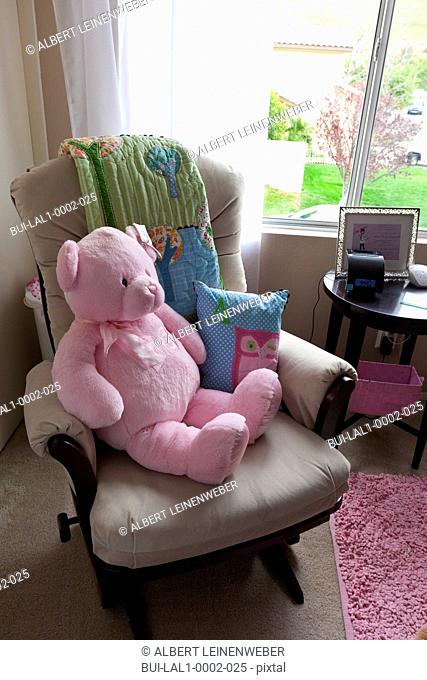Pink teddy bear on rocking chair, Laguna Beach, California, USA