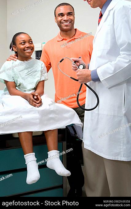 Girl with father and doctor