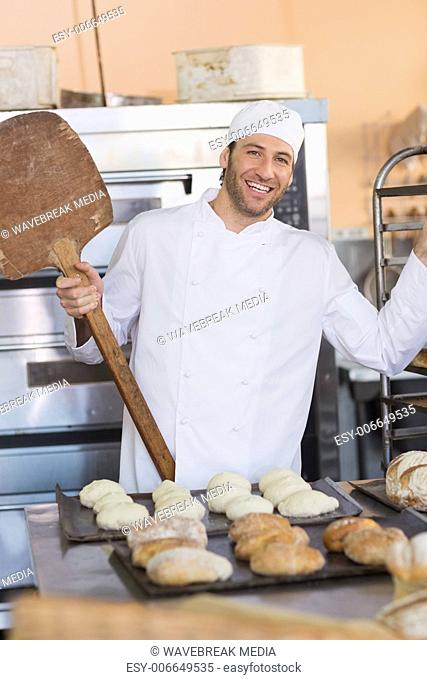 Happy baker smiling at camera