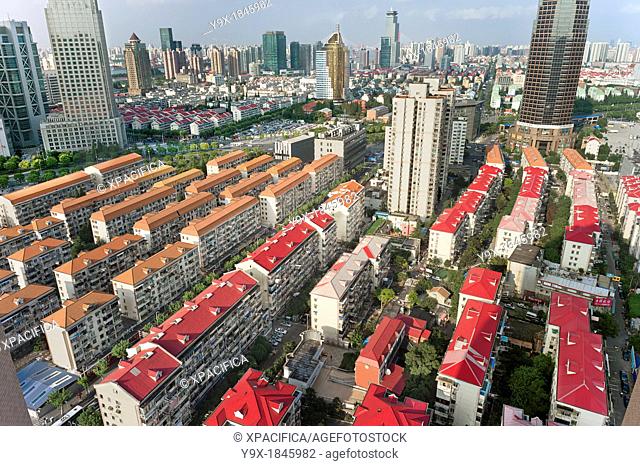 Organized rows of housing in Pudong, Shanghai, China  Rapid modernization and development has lead to cheap track housing that displaces traditional communities
