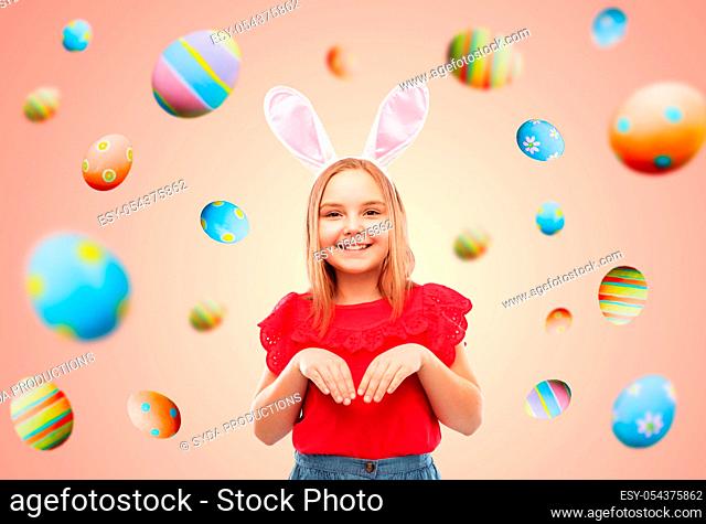 happy girl wearing easter bunny ears headband
