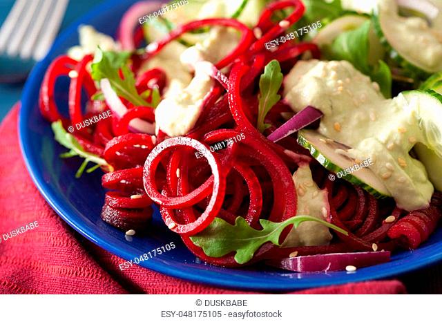 spiralized beet and cucumber salad with avocado dressing, healthy vegan meal