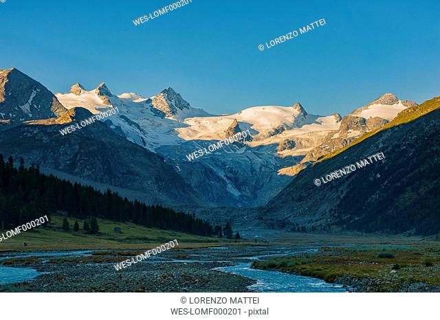 Switzerland, Roseg valley, Bernina glacier and river at sunrise in Summer
