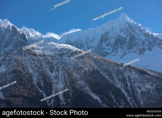 French alps mountain peaks covered with fresh snow. Winter landscape nature scene on beautiful sunny winter day