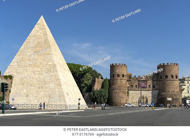 The Pyramid of Cestius and Porta San Paolo, one of the southern gates in the Aurelian Walls, in the Ostiense district, Rome, Italy
