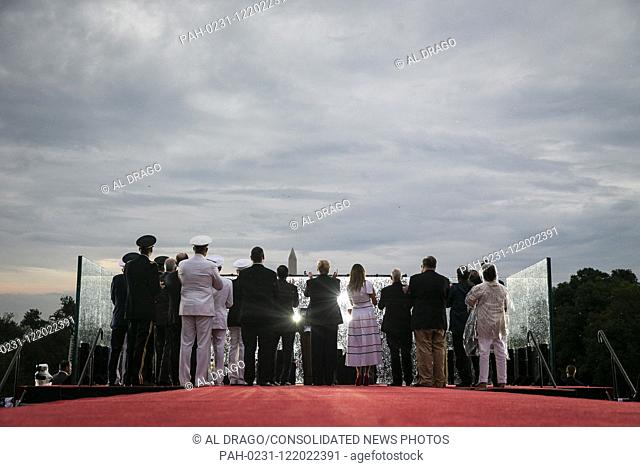 U.S. President Donald Trump and first lady Melania Trump watch with U.S. Vice President Mike Pence and guests as military planes fly overheard during the Fourth...