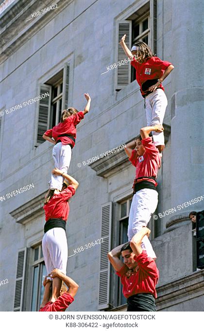 'Castellers' building human towers, a Catalan tradition. Barcelona. Spain
