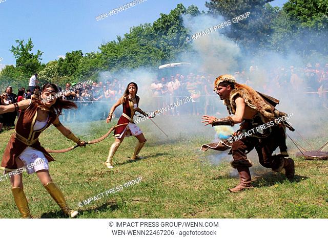 Performers take part in a battle reenactment of proto-Bulgarians against the Byzantium soldiers in the village of Arbanasy