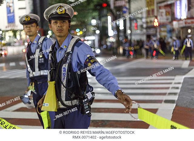 Tokyo Metropolitan Police restraints Japanese soccer fans access to Shibuya's famous scramble after their team advanced to the second round of World Cup on June...
