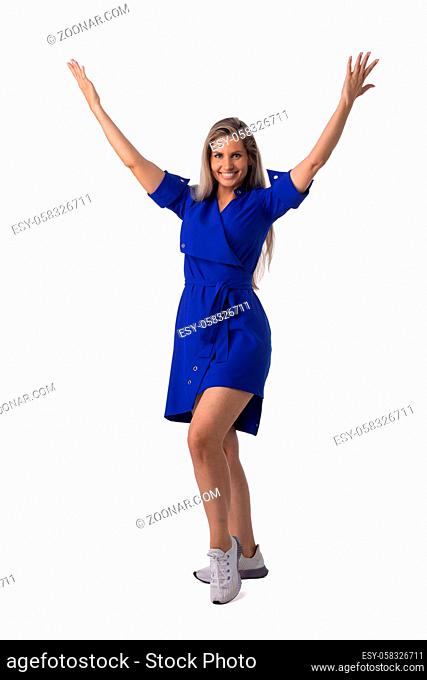 Young business woman winner with raised arms isolated on white background full length studio portrait