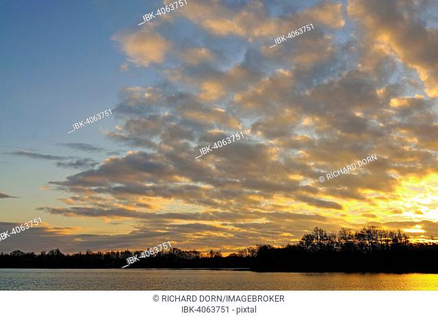 Sunrise with clouds at the lake in Menzelen, North Rhine-Westphalia, Germany