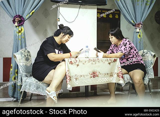 Prostitutes at the Long Xuan Chinese restaurant and brothel, the city's Chinese workers live segregated lives, almost exclusively frequenting businesses run by...
