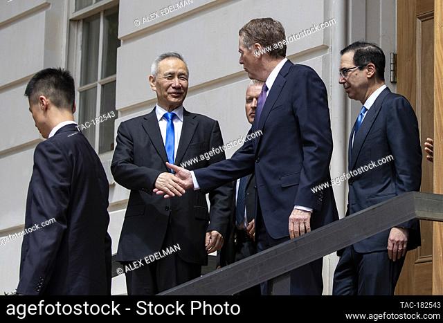 Chinese Vice Premier Liu He shakes hands with U.S. Trade Representative Robert Lighthizer as he departs following trade negotiations at the U.S