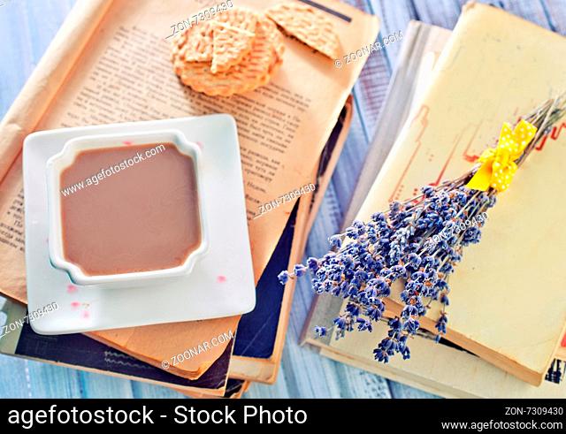 cocoa and books on the wooden table