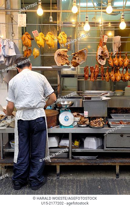 Hong Kong, China, Asia. Hong Kong Kowloon. Butcher at work