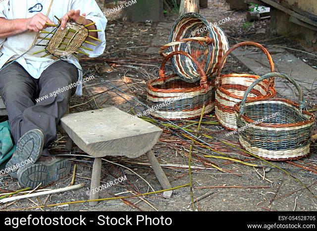 Guedelon chateau, Treigny, France - May 28, 2012: Details of the manufacturing of wickers baskets. In the heart of Puisaye, in Yonne, Burgundy
